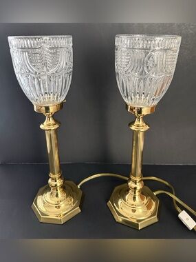 Two vintage torchiere hurricane lamps featuring crystal glass shades.